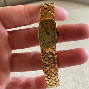 14 k solid gold Baumé & Mercier Watch, 14 k solid gold band too, not hollow gold